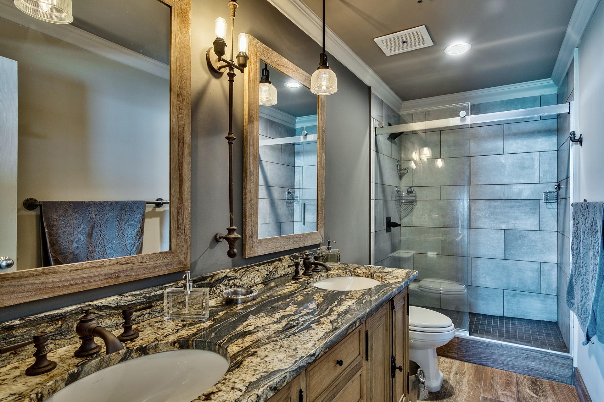 Bathrooms have Restoration Hardware vanities and fixtures.
